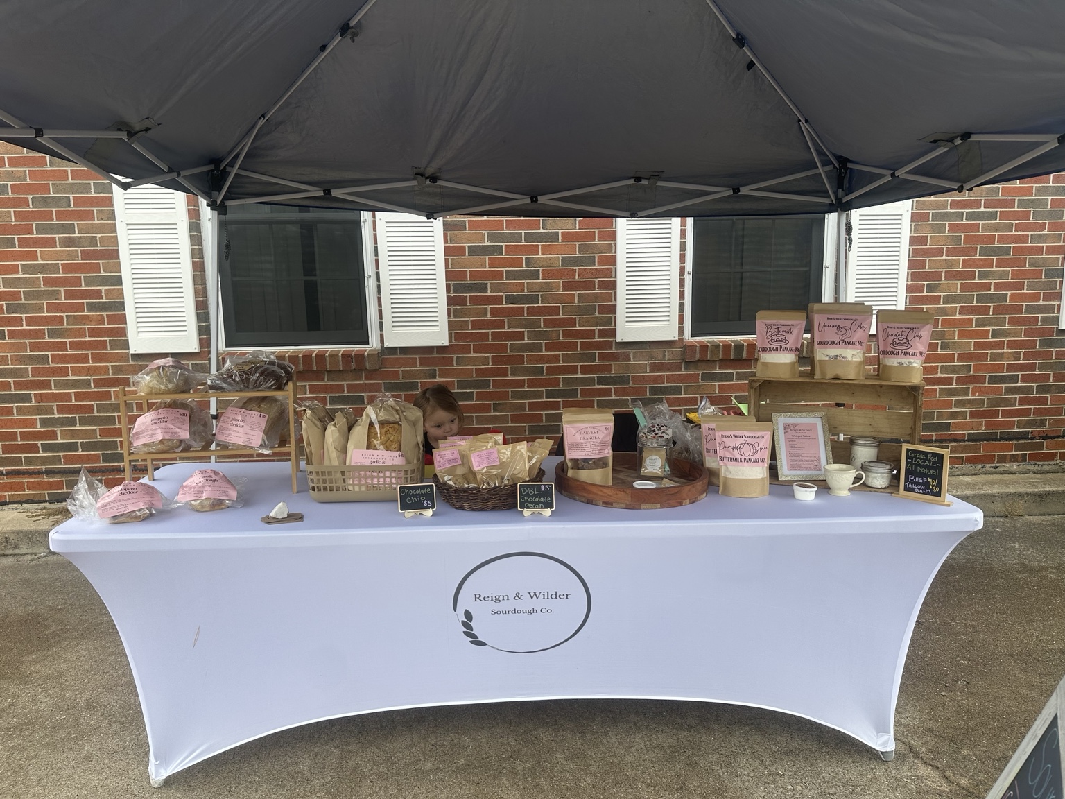 Reign and Wilder sourdough booth at a Rogersville farmers market